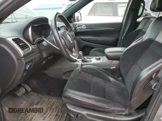 2018 Jeep Grand Cherokee Trailhawk with VIN 1C4RJFLG8JC164774, listed as a Copart auction lot 51699845 with 104,467 mi miles and Salvage title. Bid and sale history available at DreamBid. Image 7.
