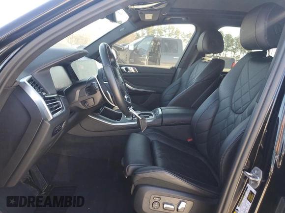 2023 BMW X5 sDrive40i with VIN 5UXCR4C06P9P01409, listed as a Copart auction lot 43127395 with 27,564 mi miles and Salvage Title. Bid and sale history available at carsss.com. Image 7.