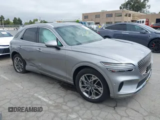 2022 Genesis GV70 2.5T z VIN KMUMADTB7NU066965, wystawiony jako IAAI lot #42363654 z przebiegiem 25 892 mil mil oraz . Historia ofert i sprzedaży dostępna na DreamBid. Obrazek 1.