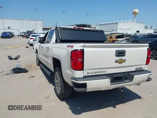 2014 Chevrolet Silverado 1500 High Country with VIN 3GCUKTEC4EG409072, listed as a IAAI auction lot 41986843 with 124,058 mi miles. Bid and sale history available at carsss.com. Image 3.
