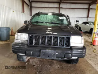 1998 Jeep Grand Cherokee Limited z VIN 1J4GZ88Z0WC276394, wystawiony jako Copart lot #46702355 z przebiegiem 144 232 mil mil oraz Szkoda całkowita • Salvage title. Historia ofert i sprzedaży dostępna na DreamBid. Obrazek 5.