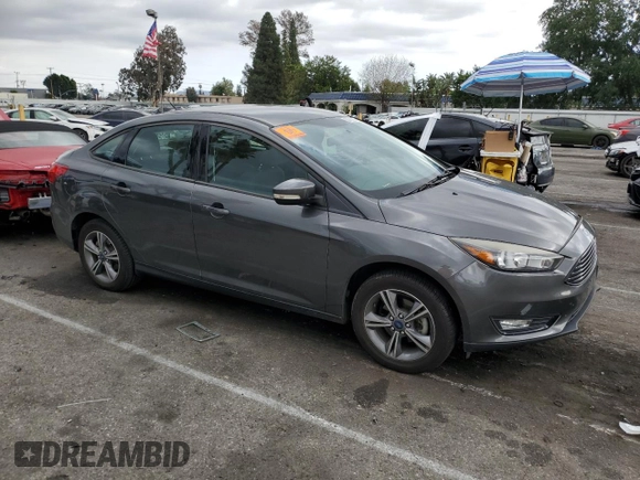 2017 Ford Focus SE with VIN 1FADP3FE3HL235896, listed as a Copart auction lot 50910975 with 74,502 mi miles and Salvage Title. Bid and sale history available at carsss.com. Image 4.
