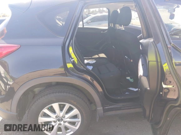 2013 Mazda CX-5 Touring with VIN JM3KE2CEXD0153589, listed as a IAAI auction lot 41855356 with 86,030 mi miles and . Bid and sale history available at DreamBid. Image 8.