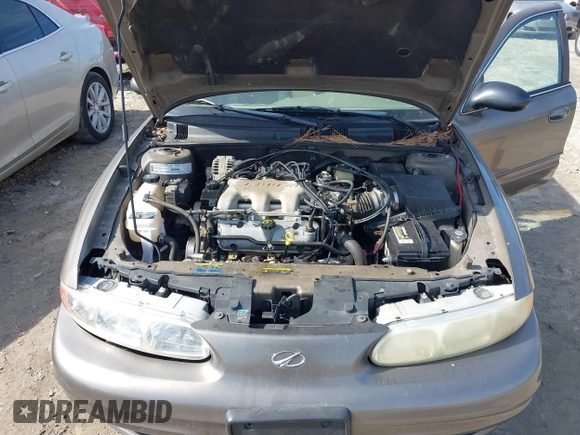 2002 Oldsmobile Alero GL1 z VIN 1G3NL52E82C172314, wystawiony jako IAAI lot #41465789 z przebiegiem 118 427 mil mil oraz . Historia ofert i sprzedaży dostępna na DreamBid. Obrazek 10.