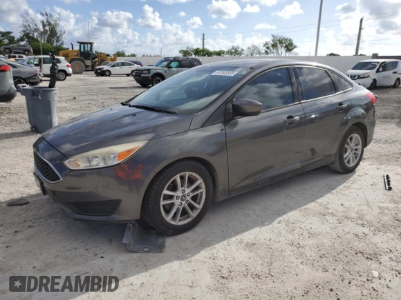 2018 Ford Focus SE with VIN 1FADP3F21JL298832, listed as a Copart auction lot 61262655 with 122,331 mi miles and Clean title. Bid and sale history available at DreamBid. Image 1.