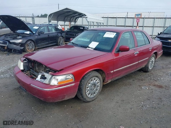 2003 Mercury Grand Marquis GS Convenience with VIN 2MEFM74W33X705854, listed as a IAAI auction lot 41619958 with 149,356 mi miles. Bid and sale history available at carsss.com. Image 6.