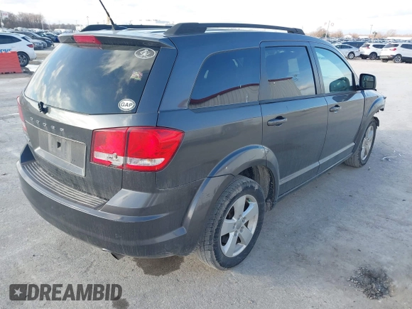 2014 Dodge Journey SE with VIN 3C4PDCAB0ET283756, listed as a IAAI auction lot 41490472 with 122,695 mi miles. Bid and sale history available at carsss.com. Image 4.