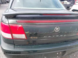 2000 Cadillac Catera z VIN W06VR54R0YR002664, wystawiony jako IAAI lot #41857553 z przebiegiem 86 354 mil mil oraz . Historia ofert i sprzedaży dostępna na DreamBid. Obrazek 14.