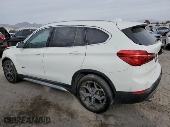 2018 BMW X1 sDrive28i with VIN WBXHU7C37J5H44386, listed as a Copart auction lot 42167135 with 96,668 mi miles and Salvage Title. Bid and sale history available at DreamBid. Image 2.