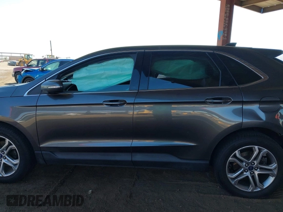 2015 Ford Edge Titanium z VIN 2FMTK3K90FBC12582, wystawiony jako IAAI lot #41860973 z przebiegiem Nie podano mil oraz . Historia ofert i sprzedaży dostępna na DreamBid. Obrazek 13.