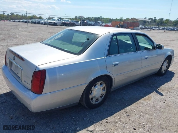 2001 Cadillac DeVille with VIN 1G6KD54Y91U235374, listed as a IAAI auction lot 41874980 with 136,090 mi miles. Bid and sale history available at carsss.com. Image 4.