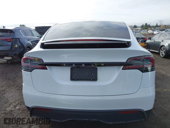 2023 Tesla Model X with VIN 7SAXCBE54PF384403, listed as a IAAI auction lot 40947187 with 16,881 mi miles and . Bid and sale history available at DreamBid. Image 17.