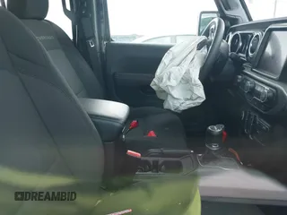 2023 Jeep Gladiator Overland z VIN 1C6HJTFG2PL523686, wystawiony jako IAAI lot #42134627 z przebiegiem 33 575 mil mil oraz . Historia ofert i sprzedaży dostępna na DreamBid. Obrazek 5.