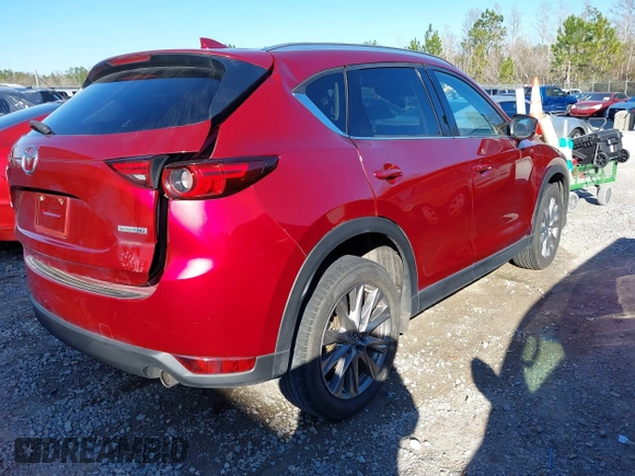 2020 Mazda CX-5 Grand Touring with VIN JM3KFADM8L0846818, listed as a IAAI auction lot 41224843 with 123,554 mi miles. Bid and sale history available at carsss.com. Image 4.