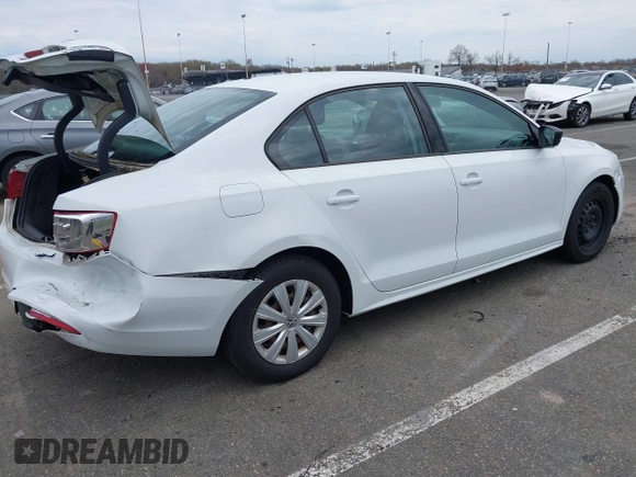 2014 Volkswagen Jetta Sedan S with VIN 3VW2K7AJ5EM329328, listed as a IAAI auction lot 41995084 with 72,409 mi miles. Bid and sale history available at carsss.com. Image 4.