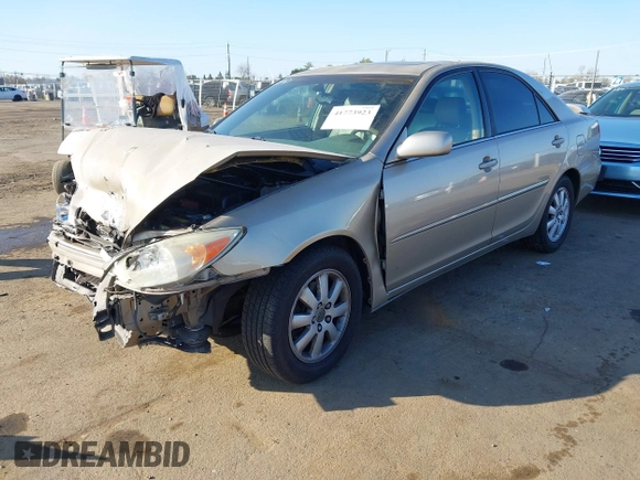 2004 Toyota Camry LE with VIN JTDBF32K140154908, listed as a IAAI auction lot 41773923 with 133,028 mi miles. Bid and sale history available at carsss.com. Image 2.