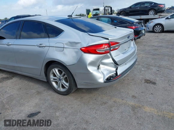 2018 Ford Fusion SE z VIN 3FA6P0LU2JR281231, wystawiony jako IAAI lot #41963083 z przebiegiem 115 434 mil mil oraz . Historia ofert i sprzedaży dostępna na DreamBid. Obrazek 6.