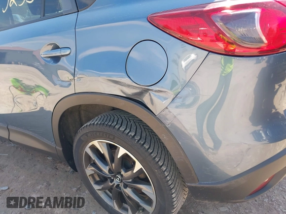 2016 Mazda CX-5 Grand Touring z VIN JM3KE4DY6G0785255, wystawiony jako IAAI lot #41887066 z przebiegiem 171 334 mil mil oraz . Historia ofert i sprzedaży dostępna na DreamBid. Obrazek 21.