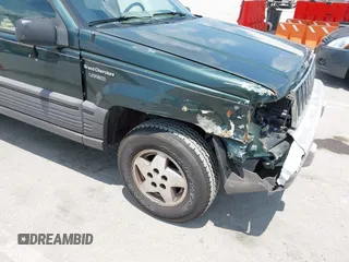 1995 Jeep Grand Cherokee Laredo with VIN 1J4FX58S0SC716398, listed as a IAAI auction lot 42647346 with 58,184 mi miles and . Bid and sale history available at DreamBid. Image 13.