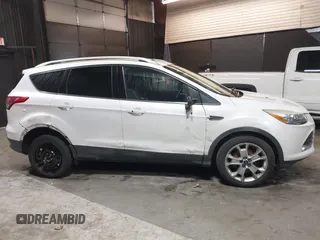 2016 Ford Escape Titanium with VIN 1FMCU9J94GUB02810, listed as a IAAI auction lot 41643907 with 119,684 mi miles. Bid and sale history available at carsss.com. Image 6.
