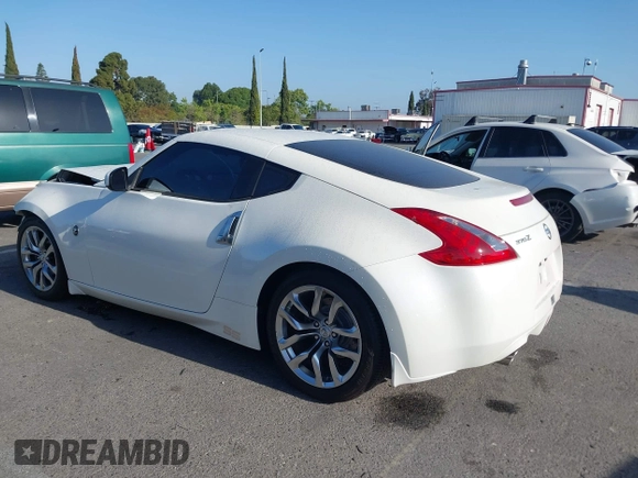 2014 Nissan 370Z Touring with VIN JN1AZ4EH7EM635655, listed as a IAAI auction lot 42217280 with 150,200 mi miles and . Bid and sale history available at DreamBid. Image 4.