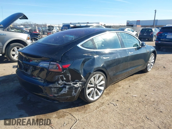 2018 Tesla Model 3 Long Range Battery with VIN 5YJ3E1EA2JF014975, listed as a IAAI auction lot 41319407 with 106,301 mi miles and . Bid and sale history available at DreamBid. Image 4.