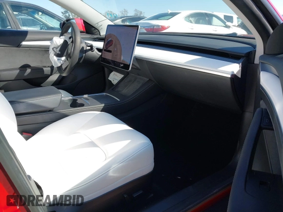 2021 Tesla Model 3 Long Range with VIN 5YJ3E1EBXMF990242, listed as a IAAI auction lot 41674222 with 24,554 mi miles and . Bid and sale history available at DreamBid. Image 5.