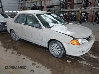 1999 Mazda Protege DX z VIN JM1BJ2229X0125332, wystawiony jako IAAI lot #41603003 z przebiegiem Nie podano mil oraz . Historia ofert i sprzedaży dostępna na DreamBid. Obrazek 1.