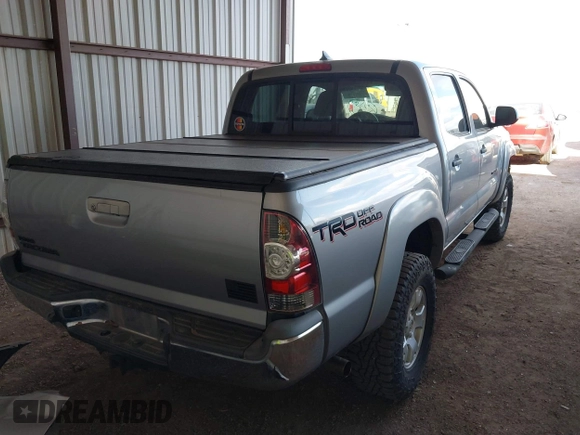 2014 Toyota Tacoma with VIN 3TMLU4EN3EM162738, listed as a IAAI auction lot 41871226 with 135,318 mi miles and . Bid and sale history available at DreamBid. Image 4.