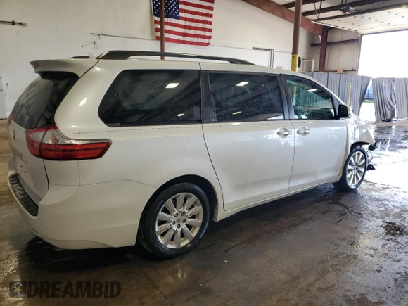 2015 Toyota Sienna XLE with VIN 5TDYK3DC4FS688299, listed as a Copart auction lot 61793155 with 57,197 mi miles and Salvage title. Bid and sale history available at DreamBid. Image 3.