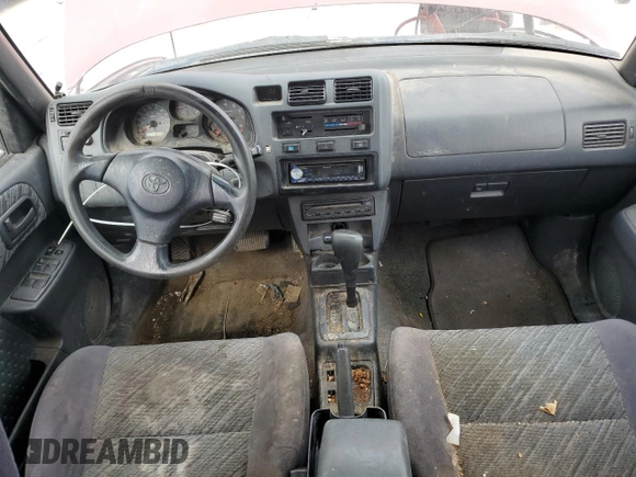 2000 Toyota RAV4 z VIN JT3HP10V2Y7162705, wystawiony jako Copart lot #54268515 z przebiegiem 310 778 mil mil oraz Czysty tytuł • Clean title. Historia ofert i sprzedaży dostępna na DreamBid. Obrazek 8.