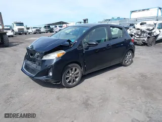 2012 Toyota Yaris L with VIN JTDKTUD35CD529596, listed as a IAAI auction lot 41439354 with 87,493 mi miles. Bid and sale history available at carsss.com. Image 2.