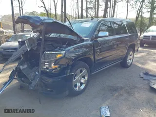 2015 Chevrolet Tahoe LTZ with VIN 1GNSKCKC2FR101306, listed as a IAAI auction lot 41909631 with 218,102 mi miles. Bid and sale history available at carsss.com. Image 2.