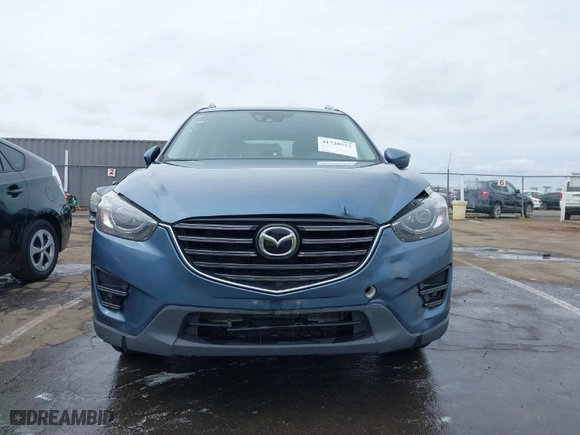 2016 Mazda CX-5 Grand Touring with VIN JM3KE4DY9G0726782, listed as a IAAI auction lot 41720512 with NaN miles. Bid and sale history available at carsss.com. Image 12.