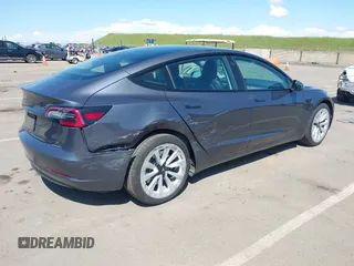 2022 Tesla Model 3 with VIN 5YJ3E1EA6NF144098, listed as a IAAI auction lot 41965360 with 75,597 mi miles. Bid and sale history available at carsss.com. Image 4.