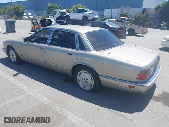1997 Jaguar XJ with VIN SAJHX1243VC811674, listed as a IAAI auction lot 42333801 with 213,248 mi miles and . Bid and sale history available at DreamBid. Image 3.