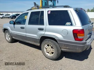 2002 Jeep Grand Cherokee Laredo with VIN 1J4GX48S52C249574, listed as a IAAI auction lot 42458883 with 89,028 mi miles and . Bid and sale history available at DreamBid. Image 3.