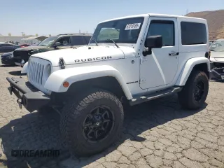 2015 Jeep Wrangler Rubicon Hard Rock z VIN 1C4BJWCG5FL561397, wystawiony jako Copart lot #61218185 z przebiegiem 164 240 mil mil oraz Czysty tytuł • Clean title. Historia ofert i sprzedaży dostępna na DreamBid. Obrazek 1.