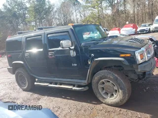 2003 Hummer H2 with VIN 5GRGN23U33H144379, listed as a IAAI auction lot 41452982 with 227,746 mi miles. Bid and sale history available at carsss.com. Image 13.