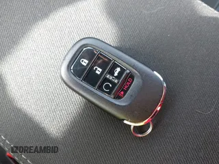 2025 Honda Civic Sport z VIN 2HGFE2F57SH519010, wystawiony jako IAAI lot #41934874 z przebiegiem 7999 mil mil oraz . Historia ofert i sprzedaży dostępna na DreamBid. Obrazek 11.
