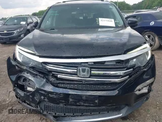 2017 Honda Pilot Touring with VIN 5FNYF5H99HB037126, listed as a IAAI auction lot 42275048 with 164,289 mi miles and . Bid and sale history available at DreamBid. Image 12.