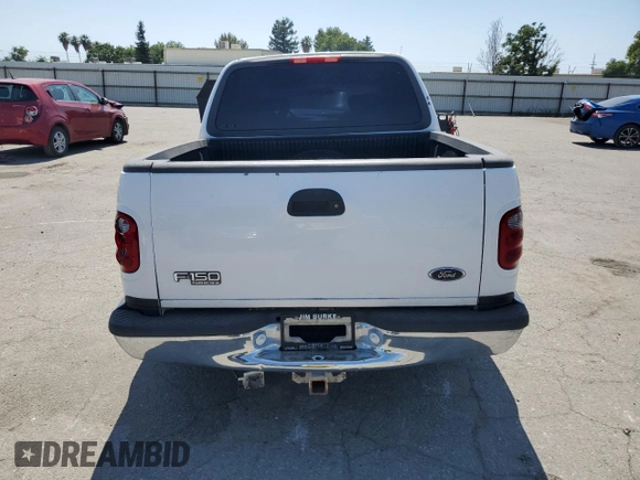 2001 Ford F-150 XLT with VIN 1FTRW07651KC49772, listed as a Copart auction lot 59904815 with 145,639 mi miles and Salvage title. Bid and sale history available at DreamBid. Image 6.