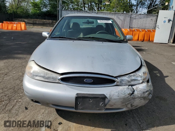 1998 Ford Contour LX with VIN 1FAFP66L2WK290948, listed as a Copart auction lot 56204295 with 76,307 mi miles and Salvage title. Bid and sale history available at DreamBid. Image 5.