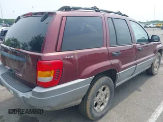 2000 Jeep Grand Cherokee Laredo z VIN 1J4GW48S2YC288439, wystawiony jako IAAI lot #42492798 z przebiegiem 272 527 mil mil oraz . Historia ofert i sprzedaży dostępna na DreamBid. Obrazek 4.