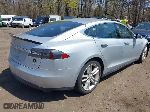 2015 Tesla Model S 85D with VIN 5YJSA1H2XFF084145, listed as a IAAI auction lot 42101755 with 105,660 mi miles. Bid and sale history available at carsss.com. Image 4.