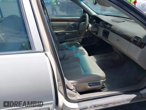 1999 Cadillac DeVille DHS z VIN 1G6KE54Y3XU714363, wystawiony jako IAAI lot #42257217 z przebiegiem 287 542 mil mil oraz . Historia ofert i sprzedaży dostępna na DreamBid. Obrazek 5.
