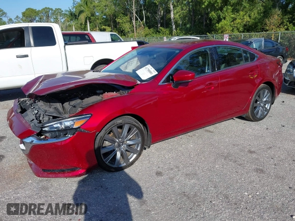 2018 Mazda 6 Grand Touring with VIN JM1GL1TY1J1302146, listed as a IAAI auction lot 41788881 with 55,852 mi miles and . Bid and sale history available at DreamBid. Image 2.