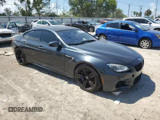2015 BMW M6 z VIN WBS6C9C52FD468030, wystawiony jako Copart lot #70863134 z przebiegiem 66 839 mil mil oraz Szkoda całkowita • Salvage title. Historia ofert i sprzedaży dostępna na DreamBid. Obrazek 4.