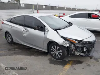 2020 Toyota Prius LE z VIN JTDKARFP6L3132469, wystawiony jako IAAI lot #42465424 z przebiegiem 60 666 mil mil oraz . Historia ofert i sprzedaży dostępna na DreamBid. Obrazek 1.
