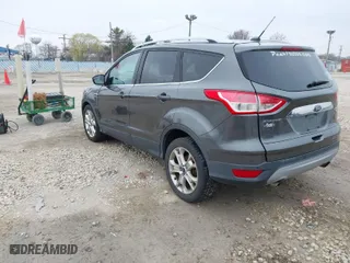 2015 Ford Escape Titanium with VIN 1FMCU0JX8FUC33649, listed as a IAAI auction lot 41992427 with 128,757 mi miles. Bid and sale history available at carsss.com. Image 3.